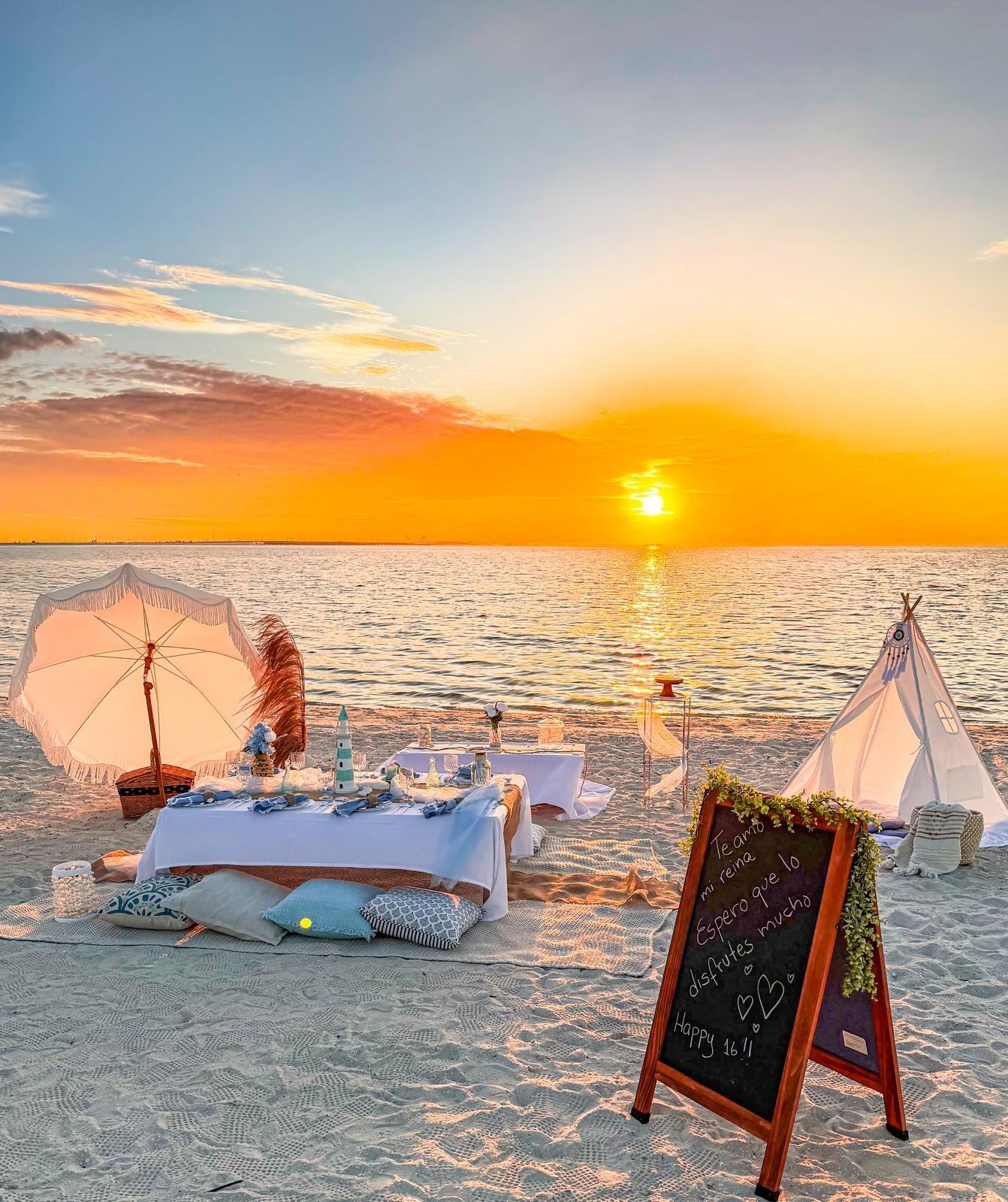 Luxury pop up picnic sunset setup on the beach